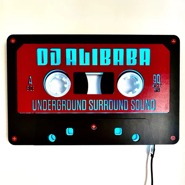 A wooden cassette tape art piece with LED lights.