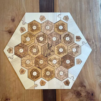 Engraved Catan base game pieces made out of solid wood featuring maple wood surround.