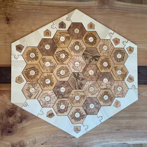 Engraved Catan extension game pieces made out of solid wood featuring maple wood surround.