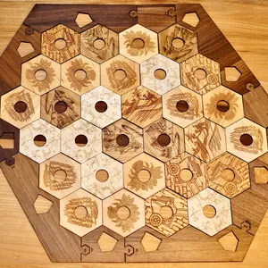 Engraved Catan extended game pieces made out of multiple solid woods featuring walnut surround.