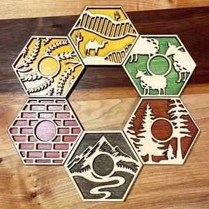 Two-layer Catan resource pieces with painted bottoms and natural wood tops.
