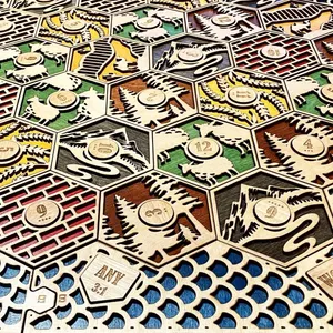 Two layer Catan game. The bottom layer is painted to match the resource and the top is natural wood.
