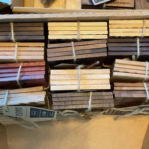 Multiple varieties of solid wood coasters bundles together with twine.