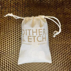 A cotton bag that has been personalized with a laser engraving for Dither and Etch.