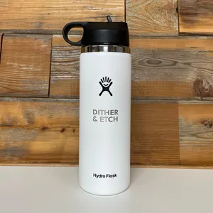A Hydro Flask water bottle that has been laser engraved with Dither and Etch.